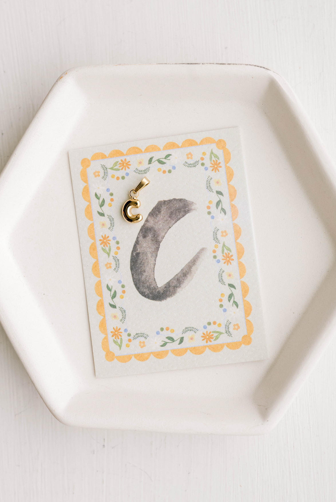 C - Letter Charm